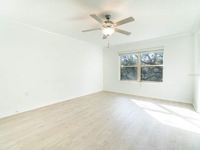 unfurnished room featuring crown molding, ceiling fan, and light wood-type flooring