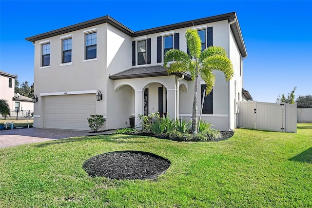 view of front of house with a garage and a front yard