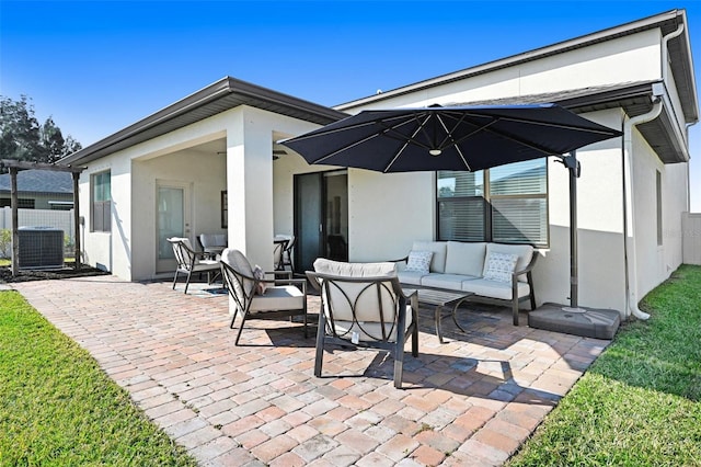 rear view of house with outdoor lounge area, central AC unit, and a patio