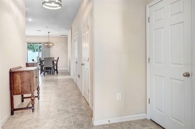 hallway featuring light tile patterned floors