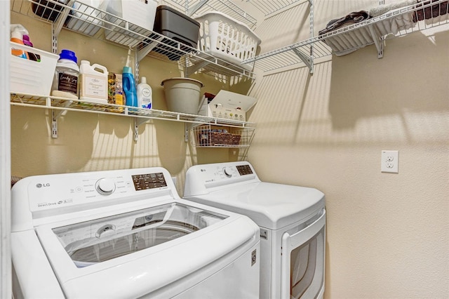 laundry room featuring separate washer and dryer