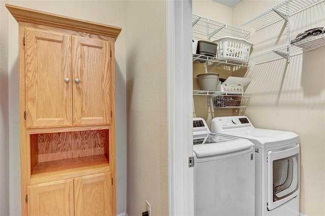 washroom featuring washer and clothes dryer