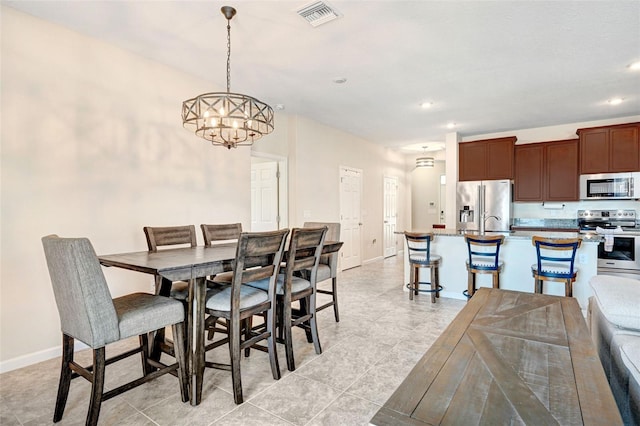 dining area featuring a chandelier