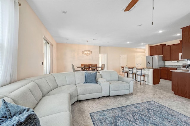 living room featuring ceiling fan