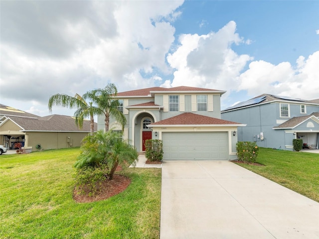 view of front of property with a garage and a front lawn