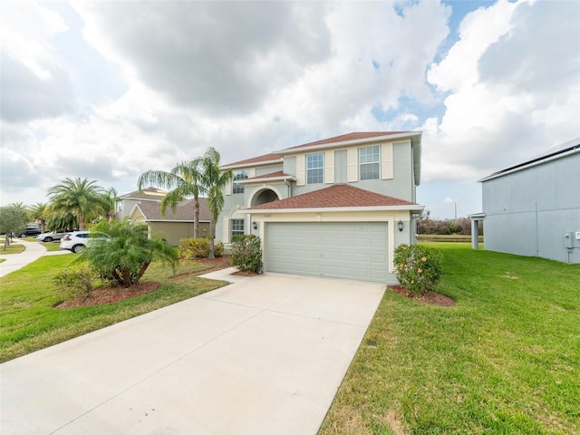 view of front of home with a garage and a front yard