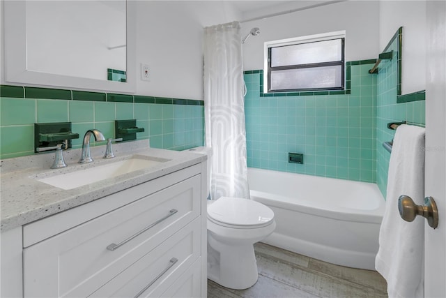 full bathroom featuring shower / tub combo, tile walls, vanity, wood-type flooring, and toilet