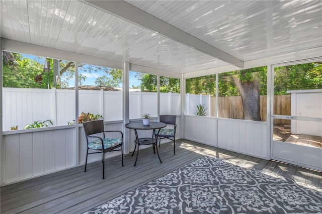 sunroom with beamed ceiling