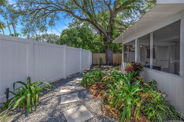 view of yard featuring a sunroom