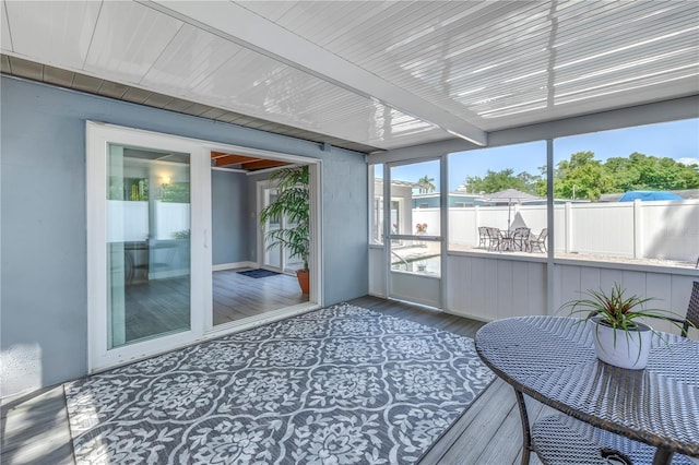 sunroom with beam ceiling