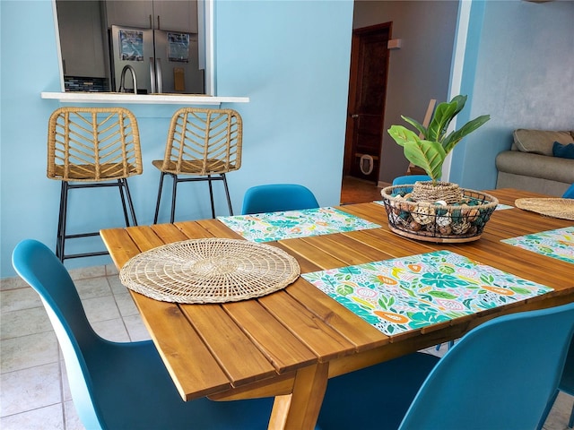 dining space with light tile patterned flooring