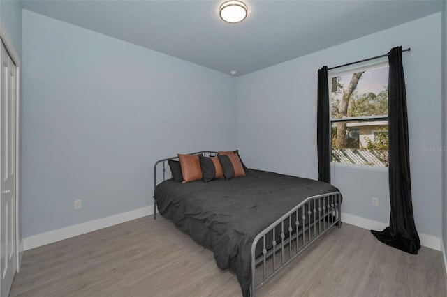 bedroom with light wood-type flooring