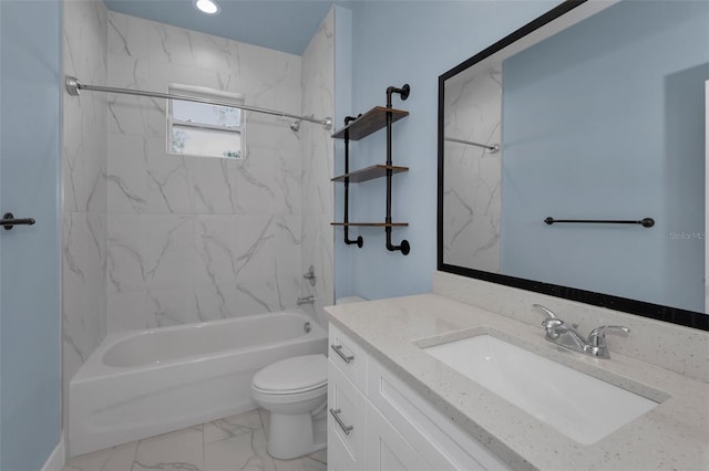 full bathroom featuring tiled shower / bath combo, vanity, and toilet