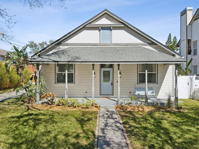 bungalow-style house with a front yard and a porch