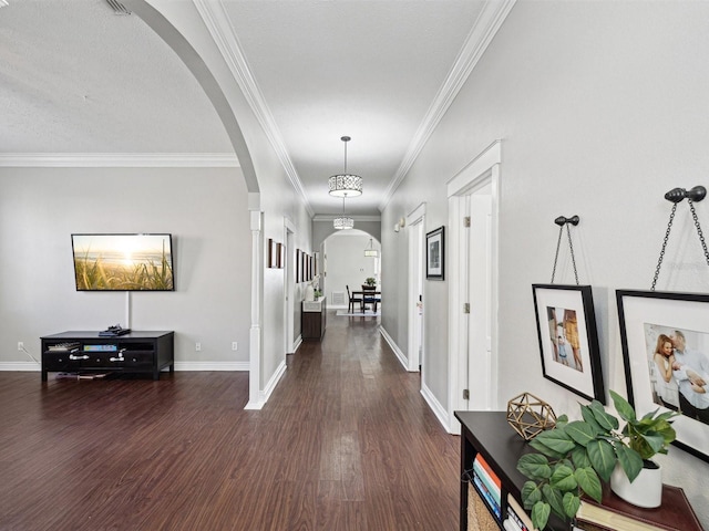 hallway featuring ornamental molding and dark hardwood / wood-style flooring