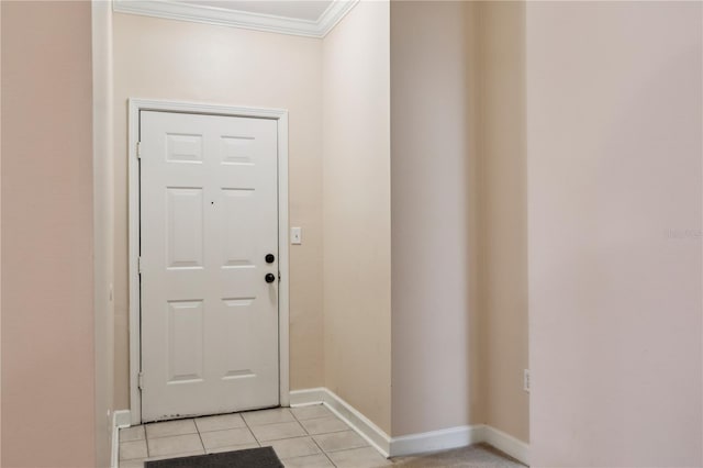 doorway with light tile patterned floors and ornamental molding