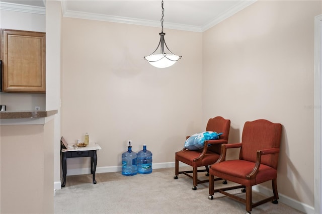 sitting room with crown molding and light colored carpet