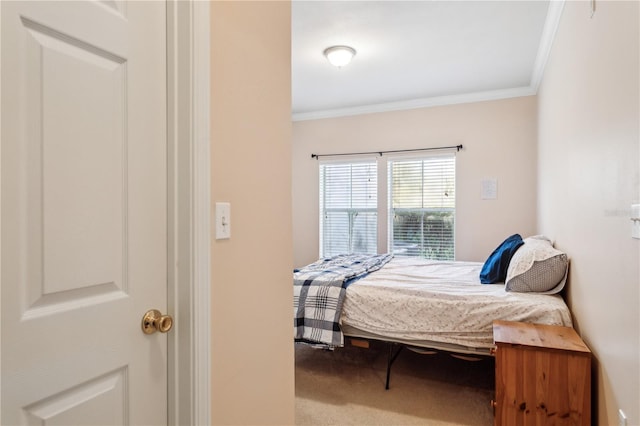 carpeted bedroom with crown molding