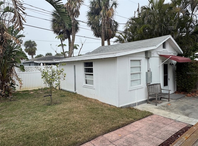 view of home's exterior with a yard