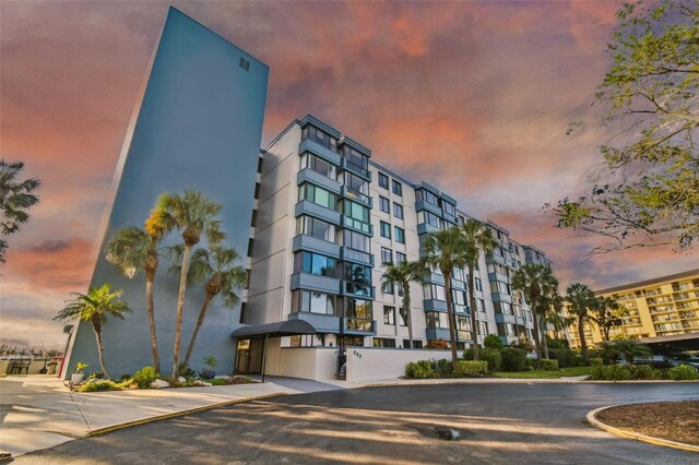 view of outdoor building at dusk