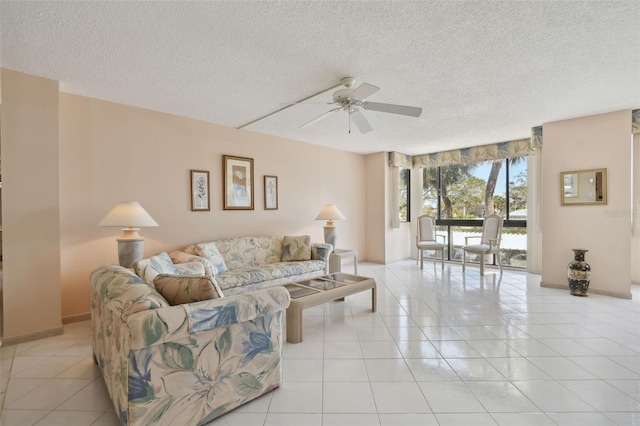 tiled living room featuring a textured ceiling and ceiling fan