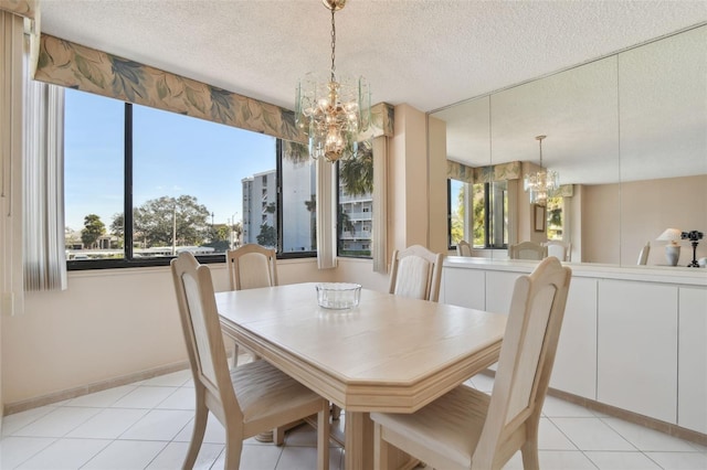 dining area with an inviting chandelier, light tile patterned floors, plenty of natural light, and a textured ceiling