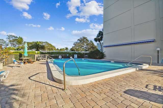 view of swimming pool with a patio area