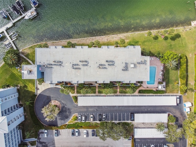 birds eye view of property with a water view