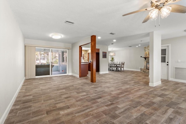 interior space featuring wood-type flooring and ceiling fan