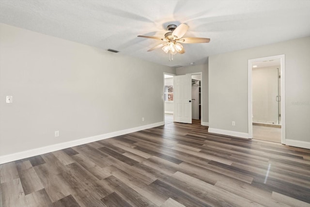 unfurnished bedroom with dark wood-type flooring and ceiling fan