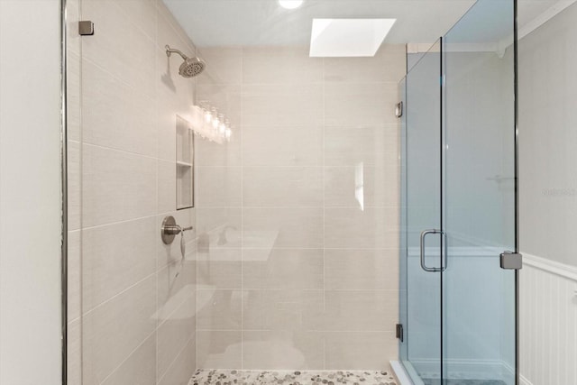 bathroom with a shower with door