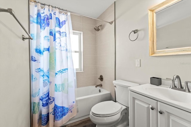 full bathroom with vanity, shower / bath combination with curtain, and toilet