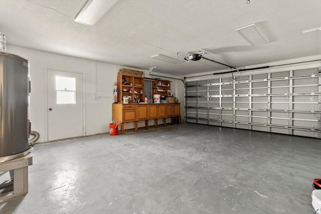 garage featuring a garage door opener and water heater