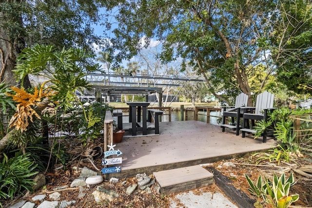 deck featuring a water view and a boat dock