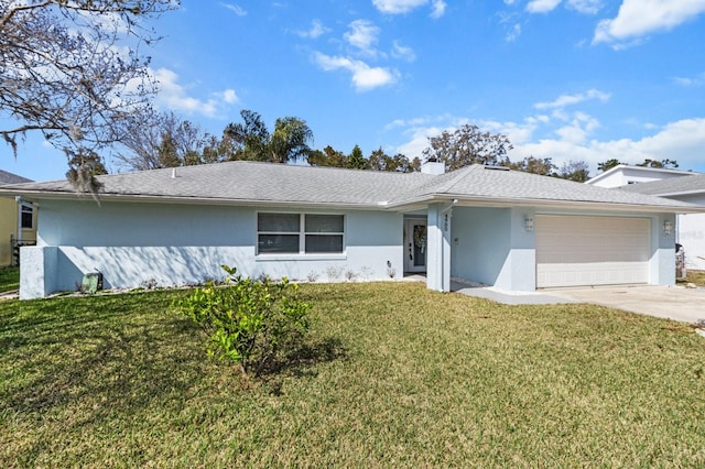 single story home featuring a garage and a front yard