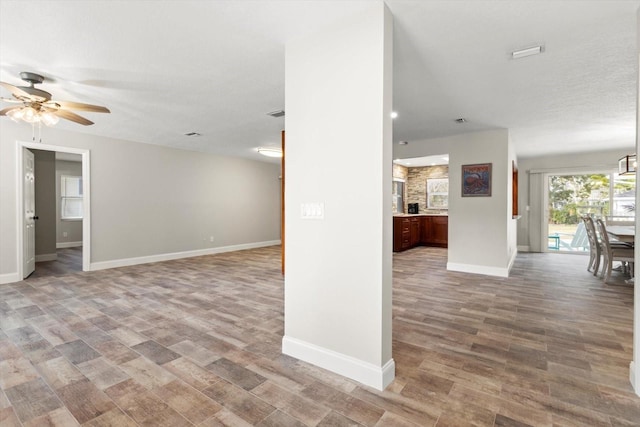 empty room featuring hardwood / wood-style flooring and ceiling fan