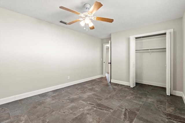 unfurnished bedroom featuring a closet and ceiling fan