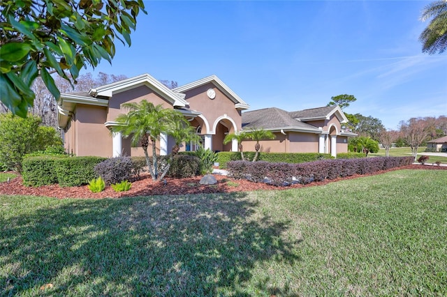 view of front of house featuring a garage and a front lawn