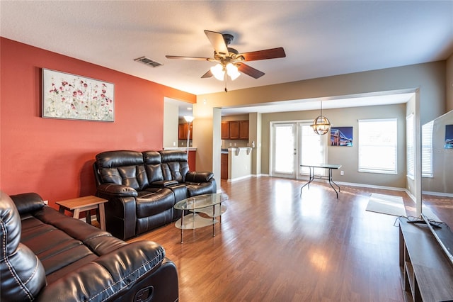 living room with ceiling fan and light hardwood / wood-style floors