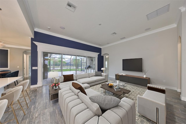 living room with crown molding and dark wood-type flooring