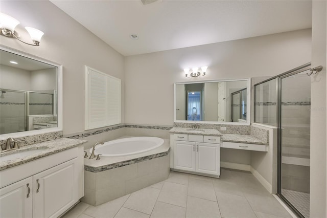 bathroom with independent shower and bath, vanity, and tile patterned flooring