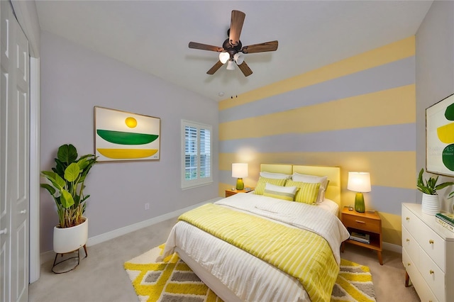 carpeted bedroom featuring ceiling fan