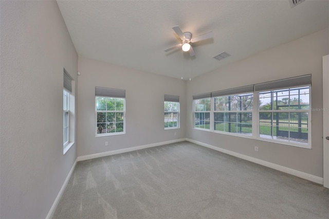 unfurnished room featuring ceiling fan and light colored carpet