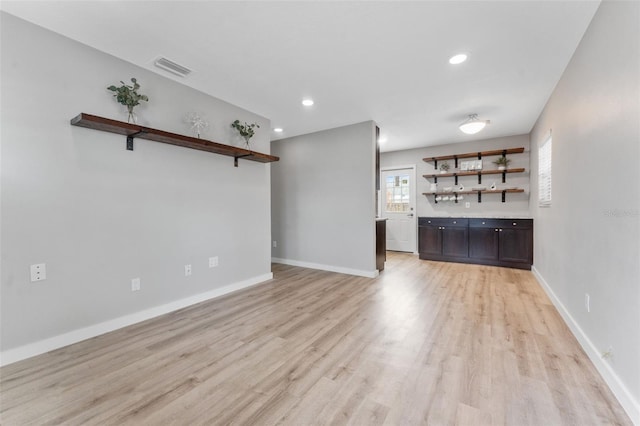 unfurnished living room with light hardwood / wood-style flooring