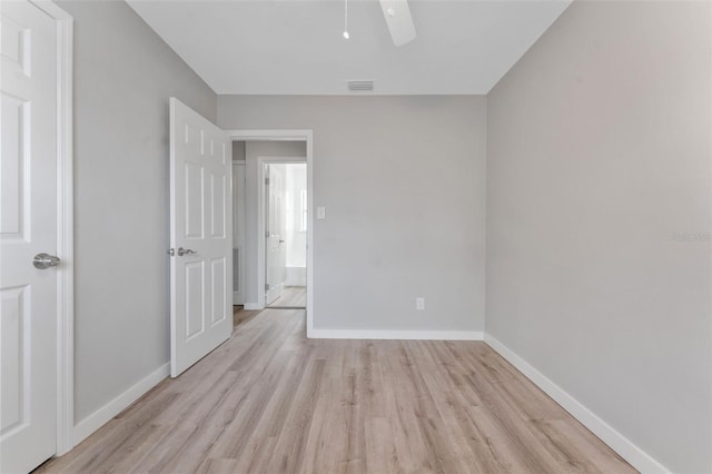 unfurnished room with ceiling fan and light wood-type flooring