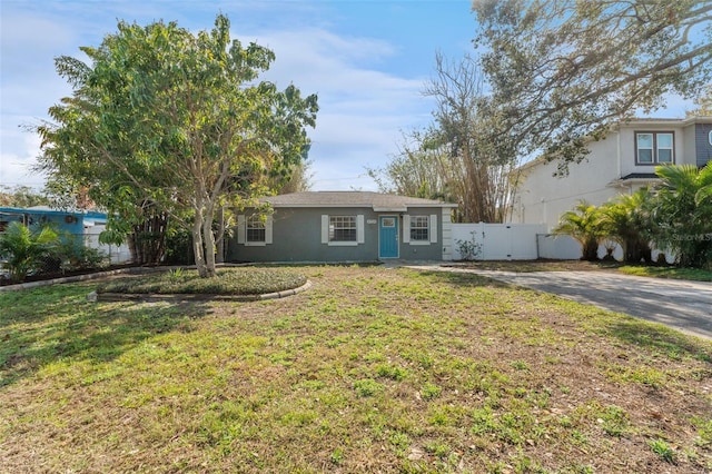 ranch-style house with a front lawn