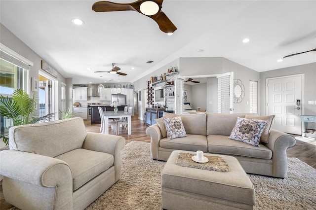 living room with hardwood / wood-style flooring and ceiling fan