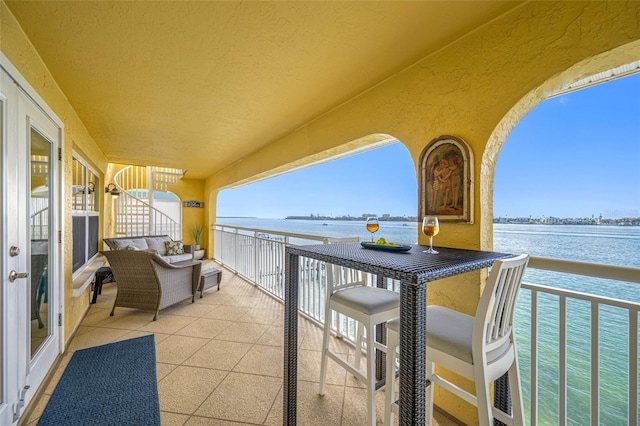 balcony featuring a water view