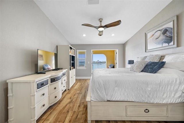 bedroom featuring ceiling fan, access to exterior, and light wood-type flooring