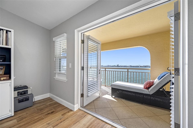 balcony featuring a water view